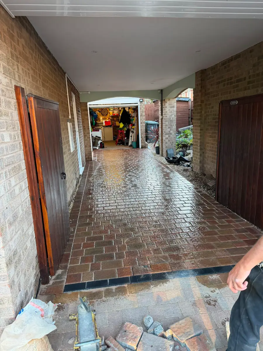 Block paved driveway under a carport