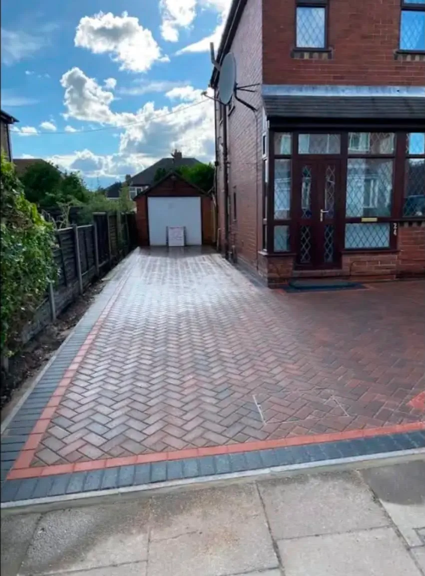 Brindle block paved driveway to a garage
