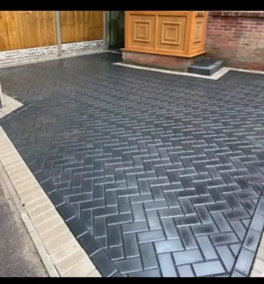 Charcoal block paving laid in herringbone