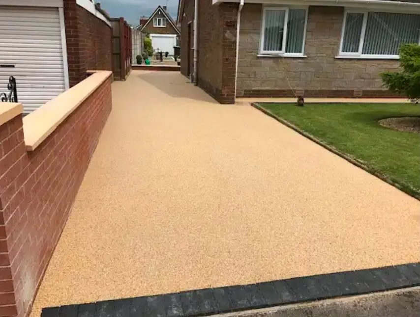 Gold resin bound driveway at a bungalow