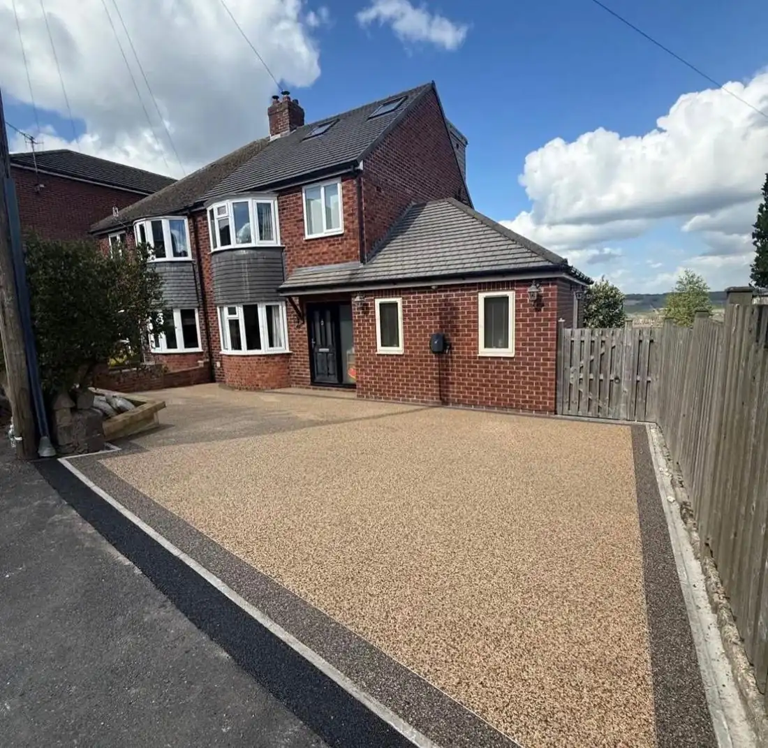 Buff resin bound driveway at a brick semi