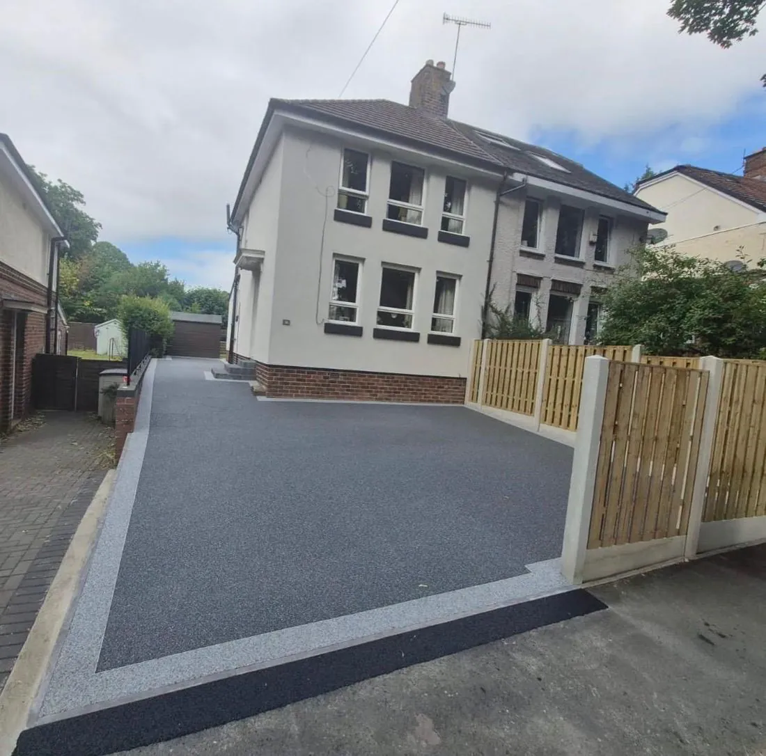 Charcoal resin bound driveway with a timber gate